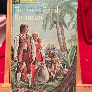 The Swiss Family Robinson and Robinson Crusoe all in one book- used